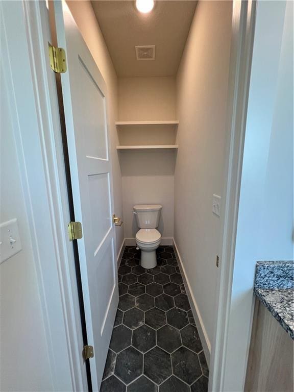 16311 Mustang St, Gardner, KS 66030 - bathroom with toilet, tile patterned floors, vanity, and baseboards