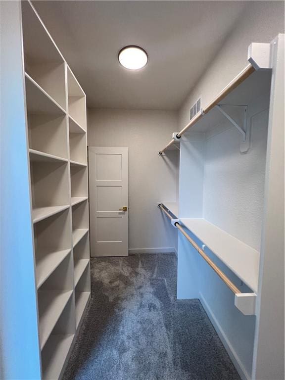 16311 Mustang St, Gardner, KS 66030 - walk in closet featuring dark colored carpet