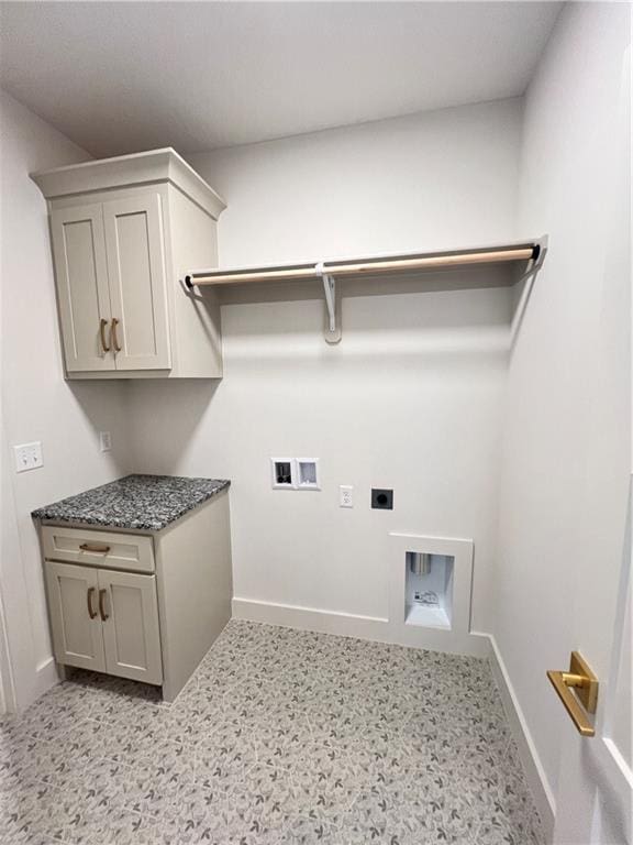 16311 Mustang St, Gardner, KS 66030 - laundry area with electric dryer hookup, baseboards, cabinet space, and hookup for a washing machine
