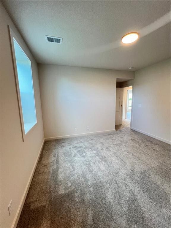 16311 Mustang St, Gardner, KS 66030 - carpeted empty room featuring baseboards