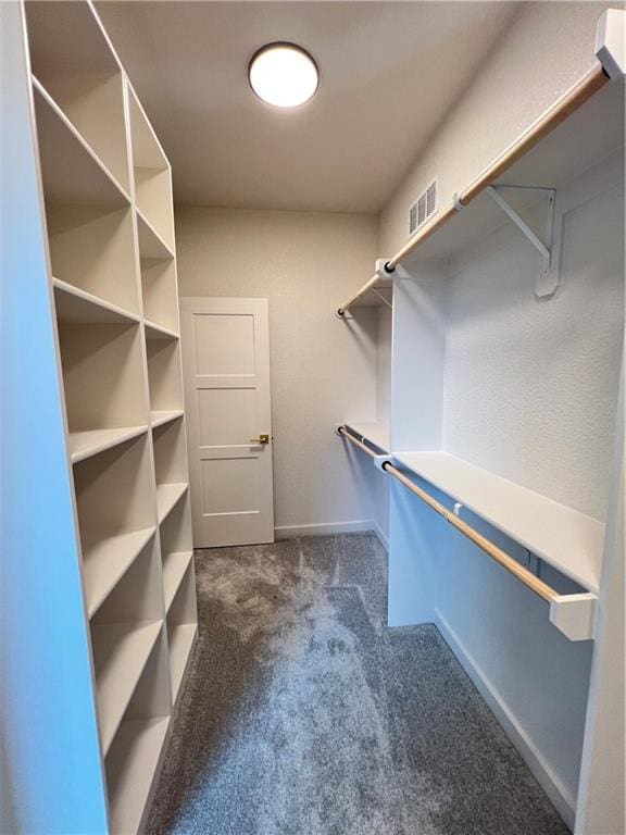 16311 Mustang St, Gardner, KS 66030 - walk in closet featuring dark colored carpet