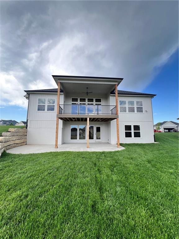 16311 Mustang St, Gardner, KS 66030 - back of property featuring a patio area and a lawn