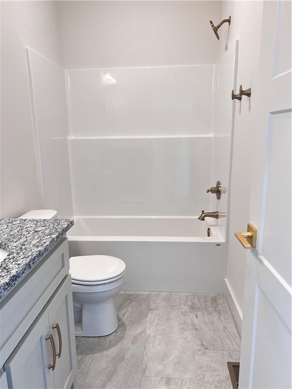 16311 Mustang St, Gardner, KS 66030 - full bath with vanity, toilet, and shower / washtub combination