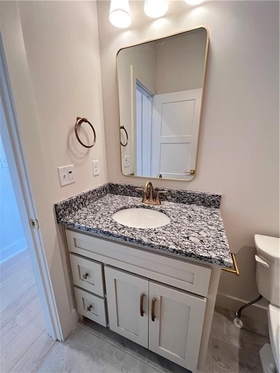 16311 Mustang St, Gardner, KS 66030 - half bath with baseboards, vanity, and toilet