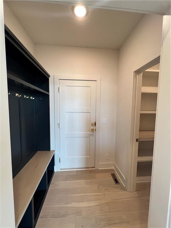 16311 Mustang St, Gardner, KS 66030 - mudroom with light wood-type flooring, baseboards, and recessed lighting