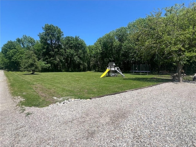 344 E 520th Ave, Pittsburg, KS 66762 - view of property's community with a trampoline and a lawn