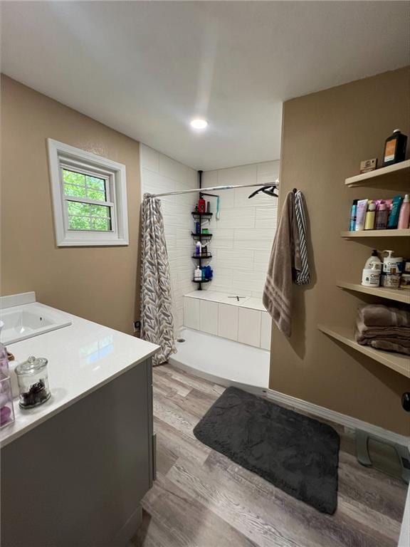 344 E 520th Ave, Pittsburg, KS 66762 - full bath featuring wood finished floors, vanity, and tiled shower