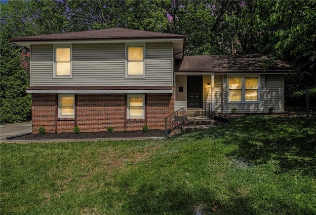 12309 Askew Dr, Grandview, MO 64030 - tri-level home with brick siding and a front lawn