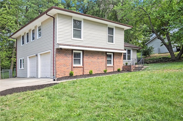 12309 Askew Dr, Grandview, MO 64030 - view of front of property with a garage, brick siding, and driveway
