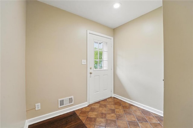 10217 Wheeling Ave, Kansas City, MO 64134 - doorway featuring baseboards and recessed lighting
