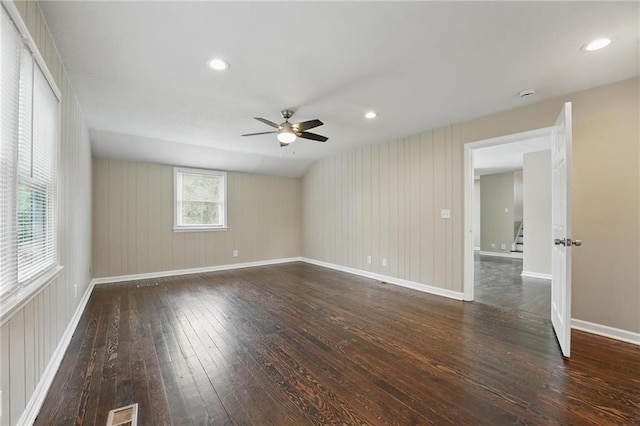 10217 Wheeling Ave, Kansas City, MO 64134 - unfurnished room with hardwood / wood-style floors, a ceiling fan, baseboards, stairs, and recessed lighting