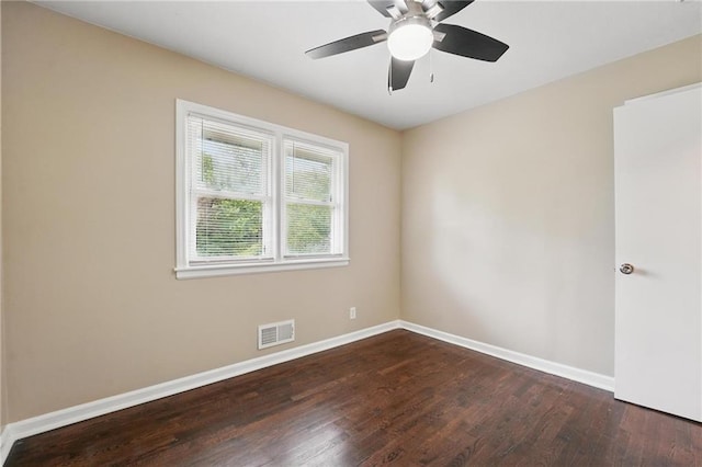 10217 Wheeling Ave, Kansas City, MO 64134 - spare room featuring wood finished floors, baseboards, and ceiling fan