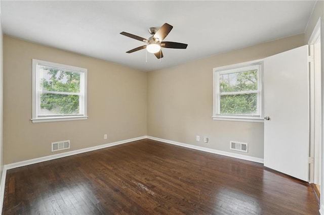10217 Wheeling Ave, Kansas City, MO 64134 - spare room featuring wood-type flooring, a ceiling fan, and baseboards