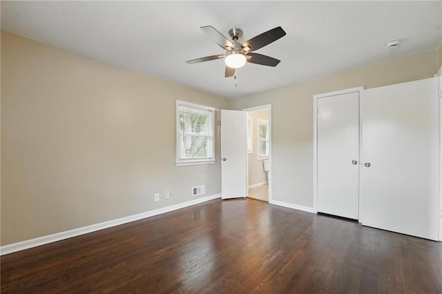 10217 Wheeling Ave, Kansas City, MO 64134 - unfurnished bedroom with wood finished floors, baseboards, a closet, and ceiling fan