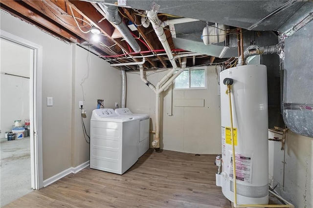 10217 Wheeling Ave, Kansas City, MO 64134 - laundry area with washing machine and dryer, gas water heater, and wood finished floors