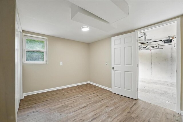 10217 Wheeling Ave, Kansas City, MO 64134 - basement featuring wood finished floors and baseboards