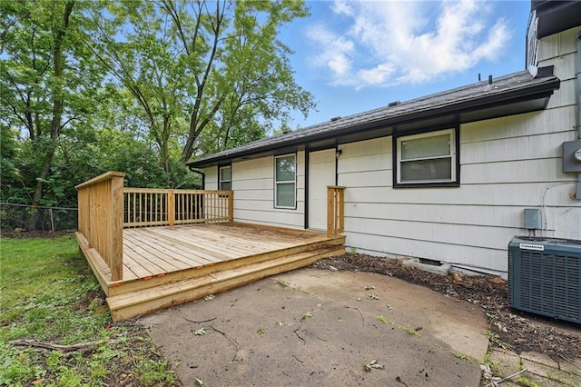 10217 Wheeling Ave, Kansas City, MO 64134 - deck with cooling unit and a patio area