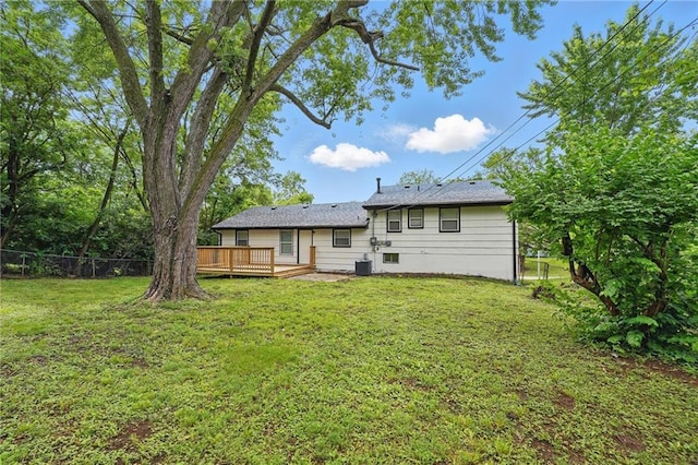 10217 Wheeling Ave, Kansas City, MO 64134 - rear view of house with a deck and central AC unit