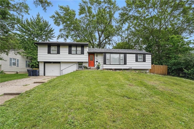 10217 Wheeling Ave, Kansas City, MO 64134 - split level home featuring driveway and an attached garage