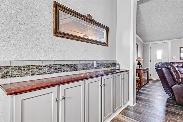 38686 Jingo Rd, Lacygne, KS 66040 - interior space featuring dark wood finished floors, a textured ceiling, crown molding, and a textured wall