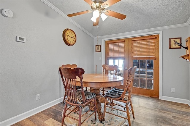 38686 Jingo Rd, Lacygne, KS 66040 - dining room featuring wood finished floors, baseboards, a textured ceiling, ceiling fan, and ornamental molding