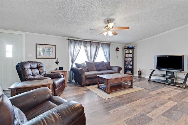 38686 Jingo Rd, Lacygne, KS 66040 - living area featuring a ceiling fan, wood finished floors, a textured ceiling, crown molding, and baseboards