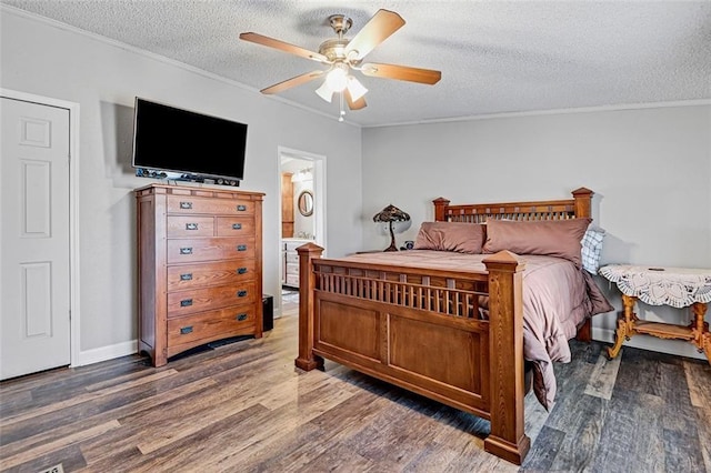 38686 Jingo Rd, Lacygne, KS 66040 - bedroom featuring ornamental molding, wood finished floors, a textured ceiling, and a ceiling fan