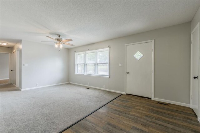 1221 Sunset St, Chillicothe, MO 64601 - foyer entrance featuring a textured ceiling, a ceiling fan, wood finished floors, and baseboards