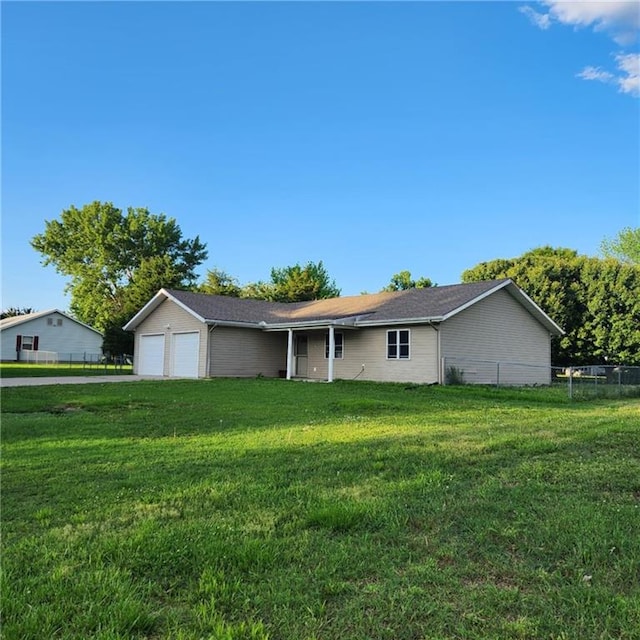 411 Briarwood Dr, Iola, KS 66749 - ranch-style house featuring a garage and driveway