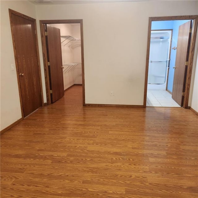 411 Briarwood Dr, Iola, KS 66749 - spare room featuring light wood finished floors and baseboards