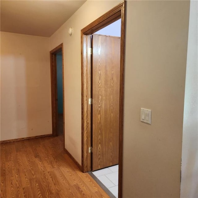 411 Briarwood Dr, Iola, KS 66749 - hall featuring light wood-style flooring and baseboards