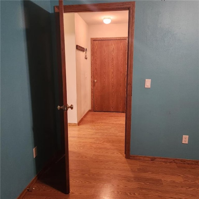 411 Briarwood Dr, Iola, KS 66749 - hall with wood finished floors and baseboards
