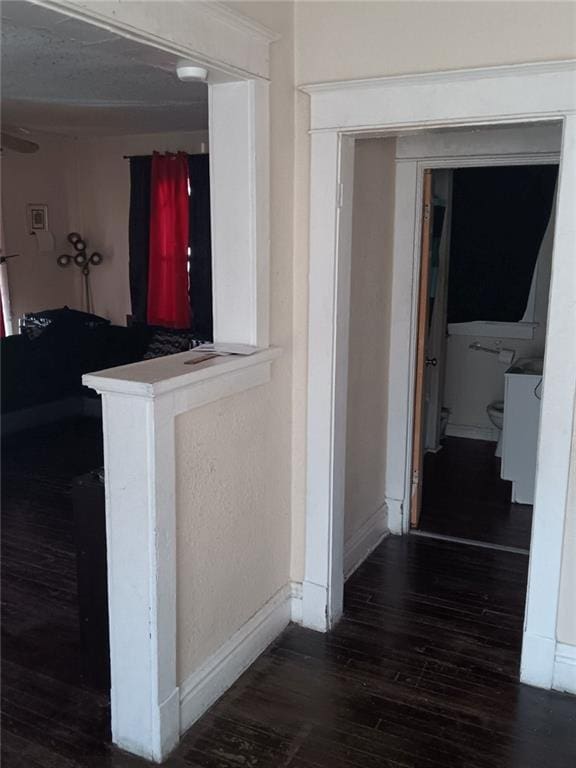 2539 Kensington Ave, Kansas City, MO 64127 - hallway featuring baseboards and dark wood finished floors