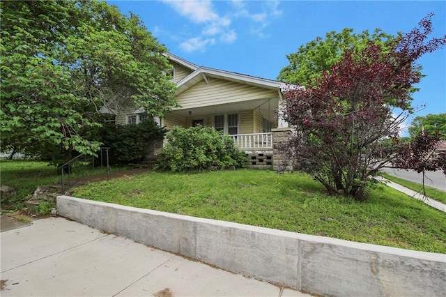 1601 Stevens Ave, Parsons, KS 67357 - view of property exterior featuring covered porch and a yard