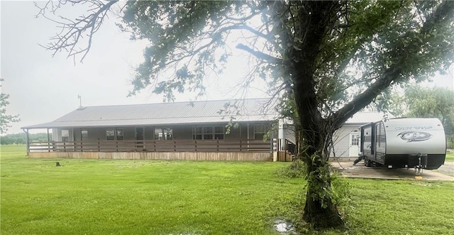 933 1300th St, Iola, KS 66749 - rear view of house featuring a yard