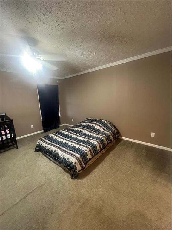 933 1300th St, Iola, KS 66749 - carpeted bedroom featuring baseboards, crown molding, a textured ceiling, and a ceiling fan