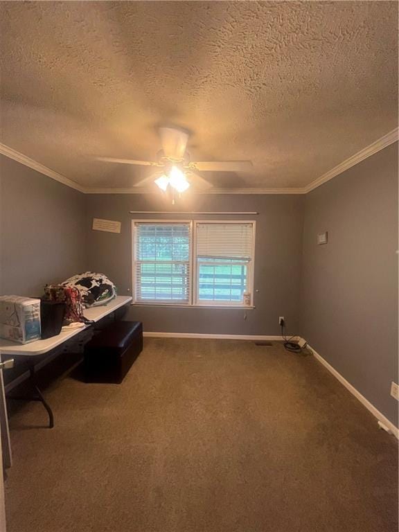 933 1300th St, Iola, KS 66749 - bedroom with a textured ceiling, crown molding, baseboards, dark carpet, and a ceiling fan