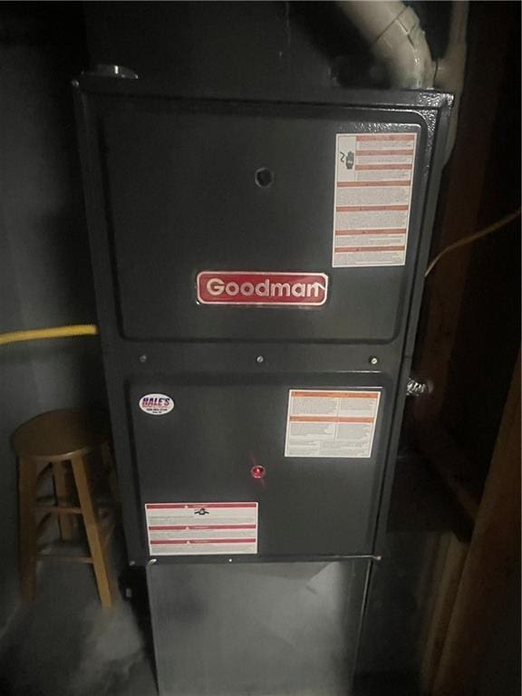 933 1300th St, Iola, KS 66749 - utility room with heating unit