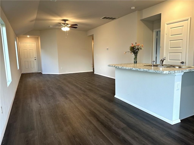 37818 W 207th Ter, Edgerton, KS 66021 - unfurnished living room with ceiling fan, dark wood-style flooring, and vaulted ceiling