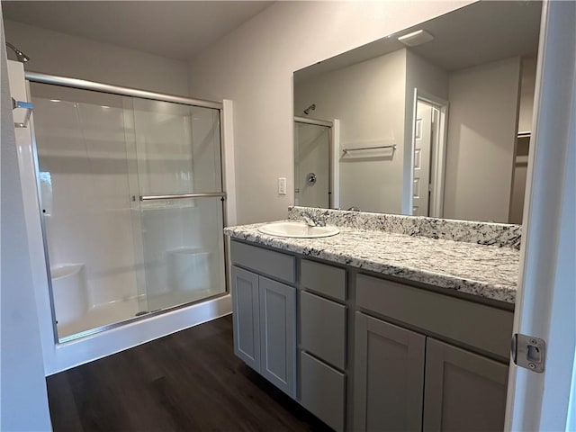 37818 W 207th Ter, Edgerton, KS 66021 - full bath with wood finished floors, a shower stall, and vanity