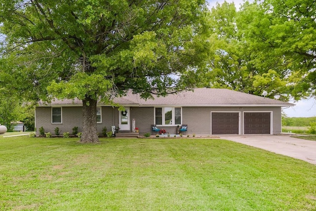 33991 Mission Belleview Rd, Louisburg, KS 66053 - view of front facade featuring an attached garage, a front lawn, and concrete driveway
