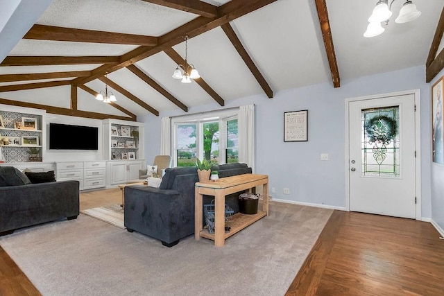 33991 Mission Belleview Rd, Louisburg, KS 66053 - living area with a chandelier, wood finished floors, and baseboards