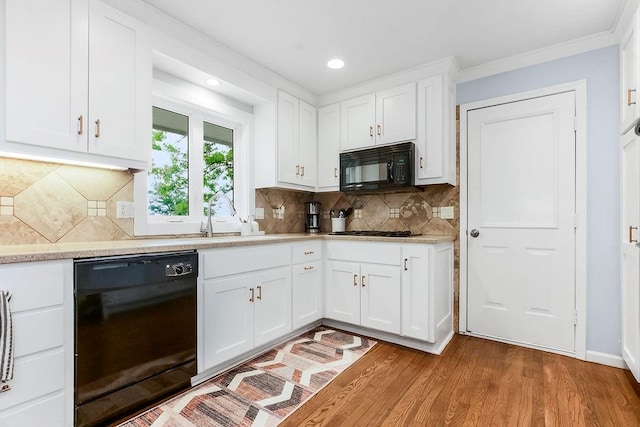 33991 Mission Belleview Rd, Louisburg, KS 66053 - kitchen featuring black appliances, a sink, white cabinetry, wood finished floors, and crown molding