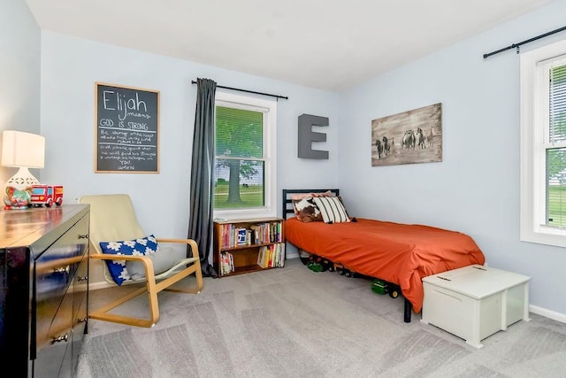 33991 Mission Belleview Rd, Louisburg, KS 66053 - carpeted bedroom with multiple windows and baseboards