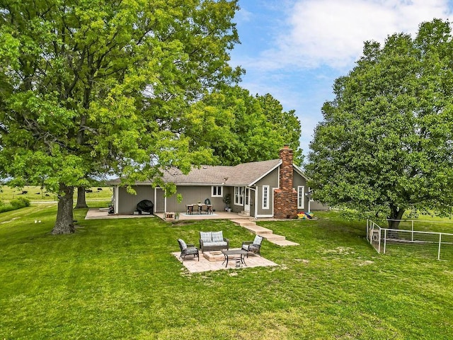 33991 Mission Belleview Rd, Louisburg, KS 66053 - rear view of house featuring a patio area and a chimney