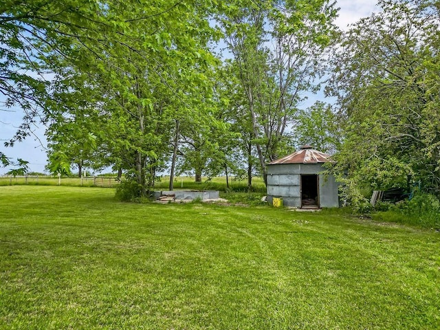 33991 Mission Belleview Rd, Louisburg, KS 66053 - view of green lawn with an outbuilding