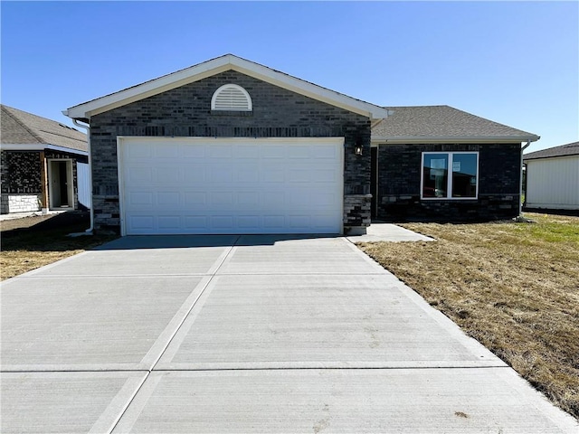 37779 W 207th Ter, Edgerton, KS 66021 - single story home with concrete driveway, a garage, and stone siding