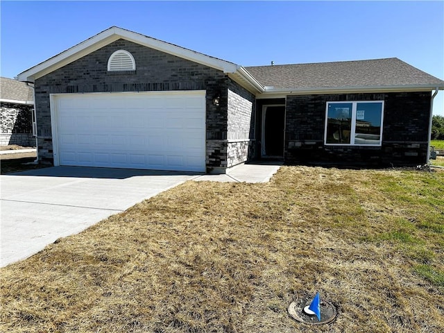 37779 W 207th Ter, Edgerton, KS 66021 - ranch-style house with concrete driveway, a garage, a front lawn, and brick siding
