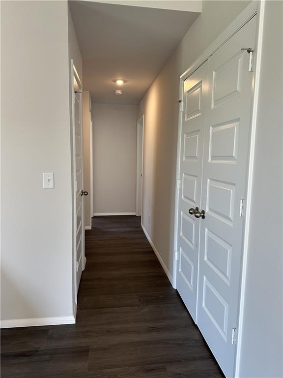 37779 W 207th Ter, Edgerton, KS 66021 - hallway with dark wood finished floors and baseboards