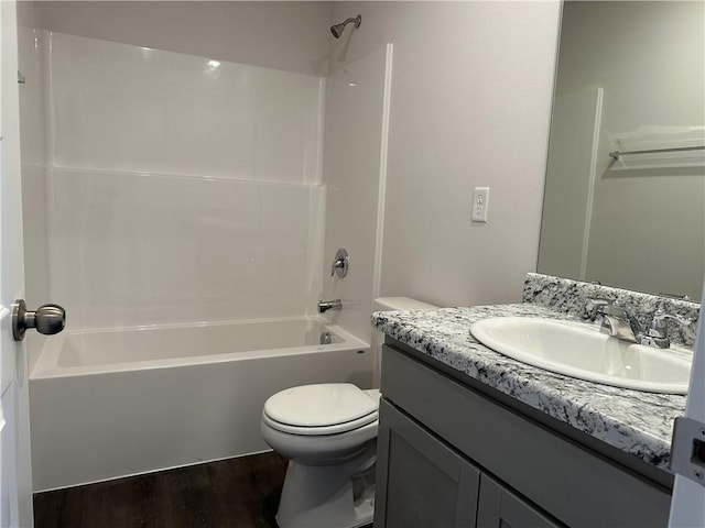 37779 W 207th Ter, Edgerton, KS 66021 - bathroom featuring toilet, vanity, wood finished floors, and shower / tub combination
